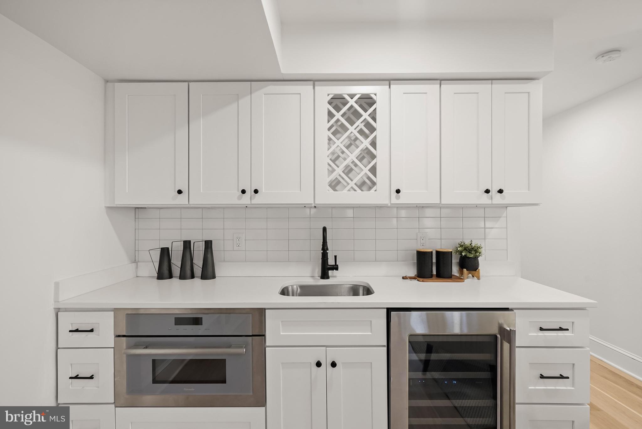 3719 R Street Northwest Washington, DC 20007 - Photo 41 of 45 Wet bar with microwave & beverage fridge