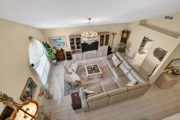 a view of a chair and tables in the patio