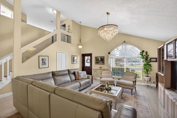 a living room with fireplace furniture and a flat screen tv