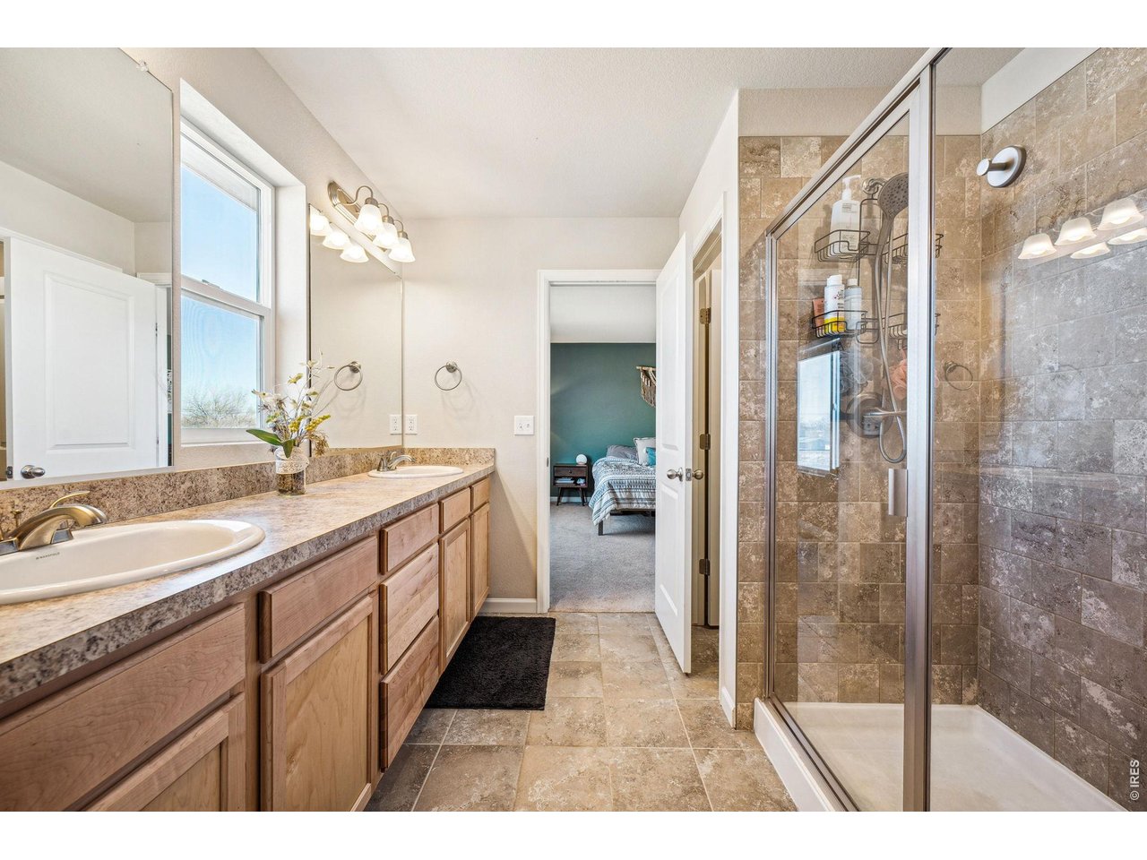 376 Country Road Berthoud, CO 80513 - Photo 20 of 33 Full primary bathroom with walk in shower and dual vanities