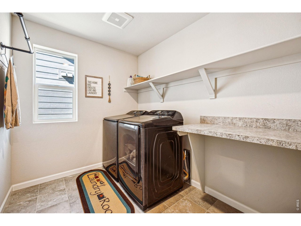 376 Country Road Berthoud, CO 80513 - Photo 28 of 33 Convenient upstairs laundry room with additional storage space
