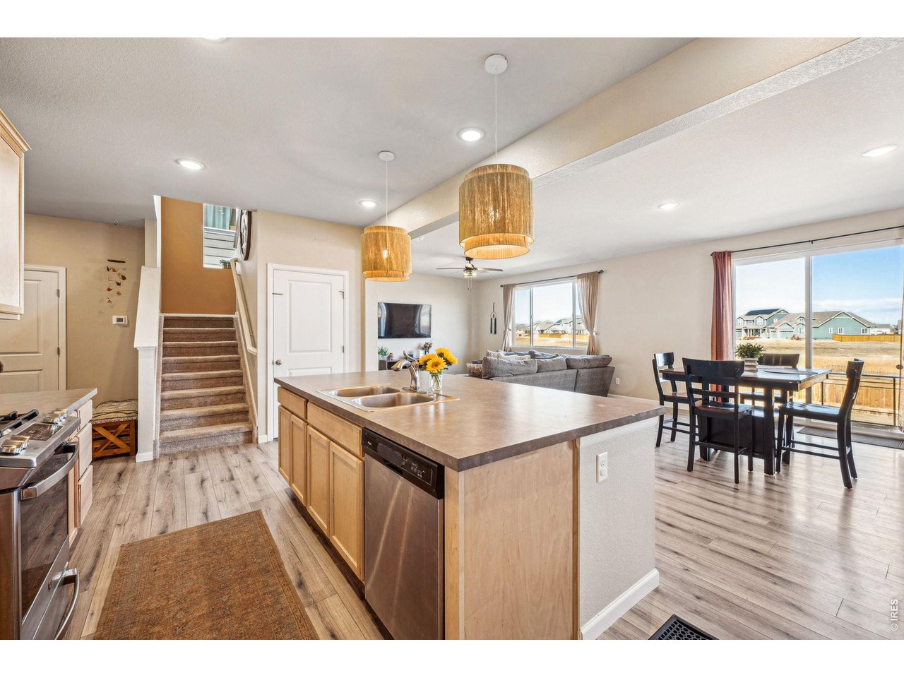 376 Country Road Berthoud, CO 80513 - Photo 6 of 33 Kitchen flows into dining and living spaces