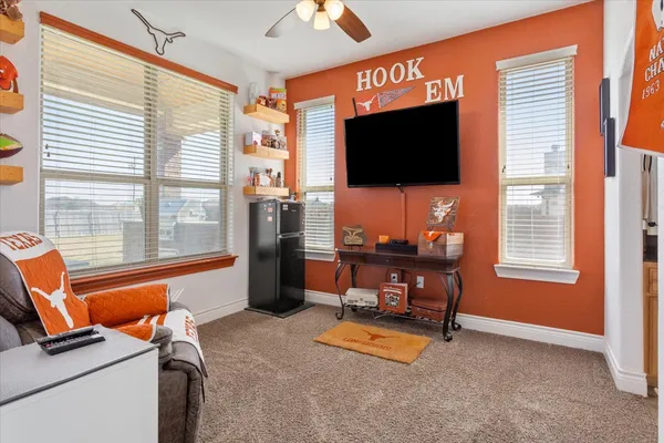 a room with furniture and a flat screen tv