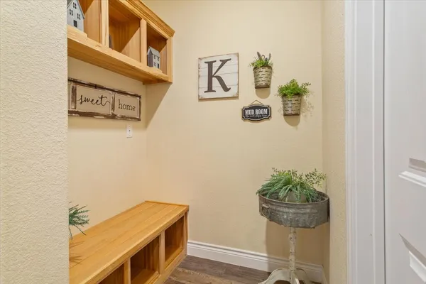 a room with a table and a potted plant