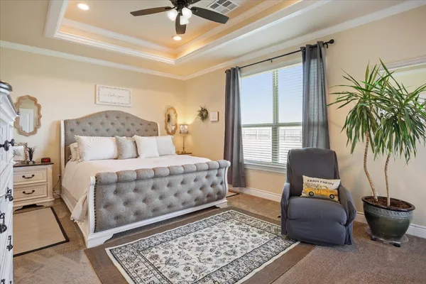 a bedroom with a bed and a couch