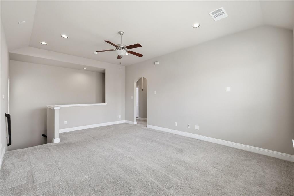 768 Huntingdon Street Coppell, TX 75019 - Photo 23 of 37 Expansive upstairs loft with plush carpet, recessed lighting, ceiling fan, and flexible space for a game room, media area, or second living room.