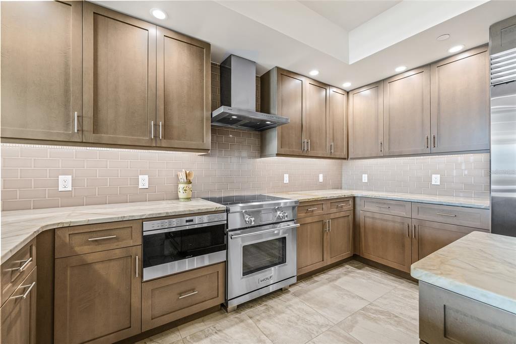795 Collany Road, Unit 205 St. Petersburg, FL 33715 - Photo 11 of 67 a kitchen with a stove sink and cabinets