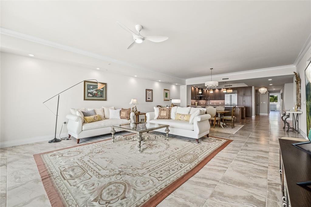 795 Collany Road, Unit 205 St. Petersburg, FL 33715 - Photo 20 of 67 a living room with furniture and a table