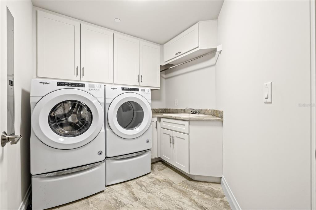 795 Collany Road, Unit 205 St. Petersburg, FL 33715 - Photo 46 of 67 a utility room with dryer and washer