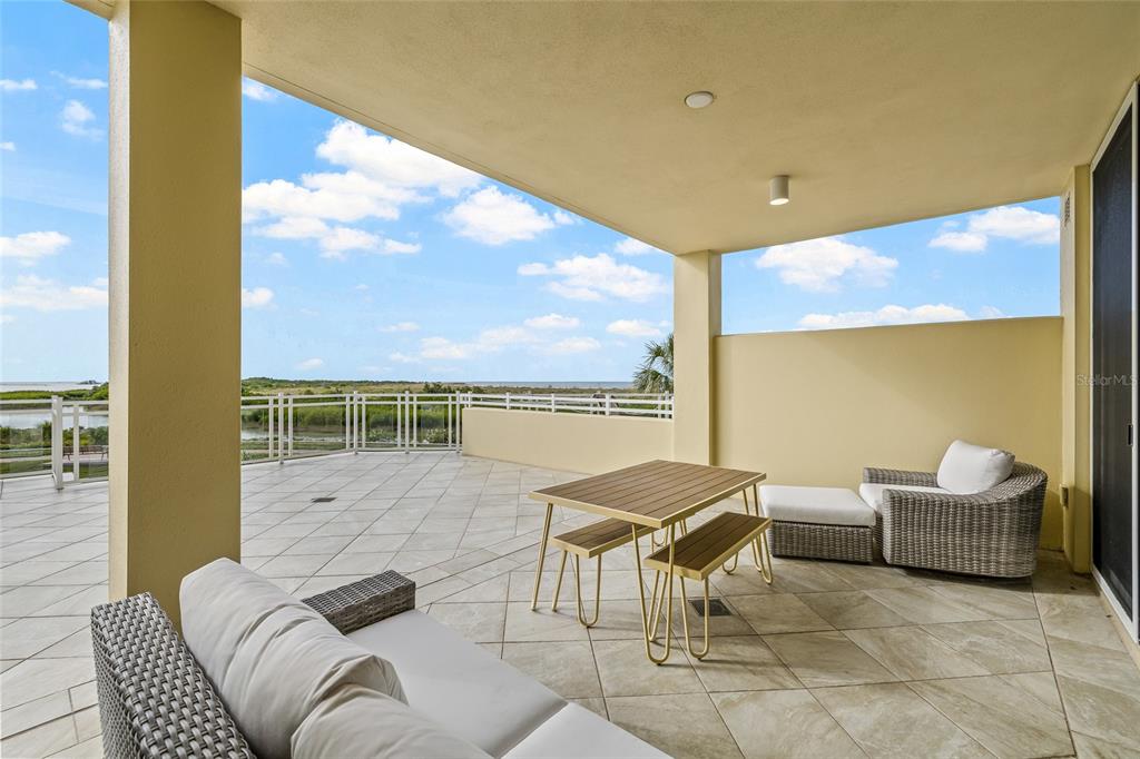 795 Collany Road, Unit 205 St. Petersburg, FL 33715 - Photo 48 of 67 a outdoor living space with furniture and city view