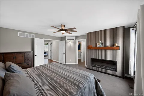 a bedroom with a bed and a television