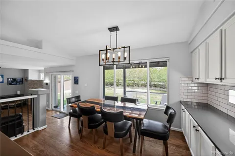 a view of a dining room with furniture window and wooden floor