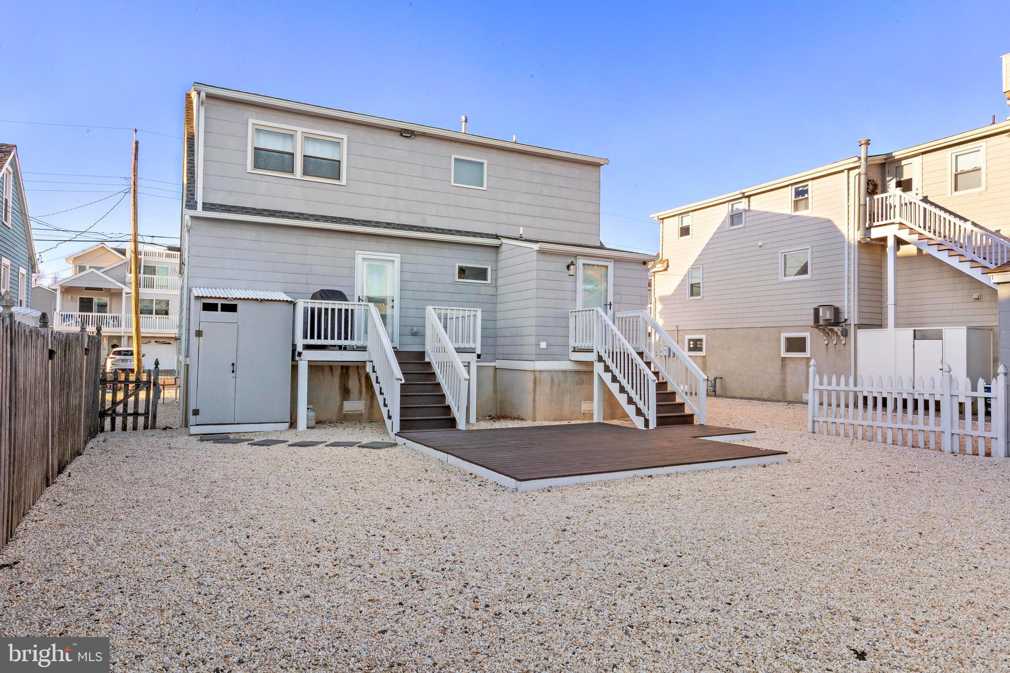 213 West 13th Street Ship Bottom, NJ 08008 - Photo 11 of 70 a view of a house with a stairs and a garage