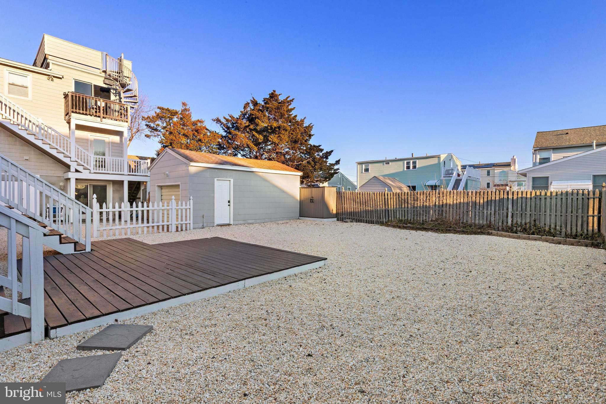 213 West 13th Street Ship Bottom, NJ 08008 - Photo 13 of 70 a view of a house with a wooden fence