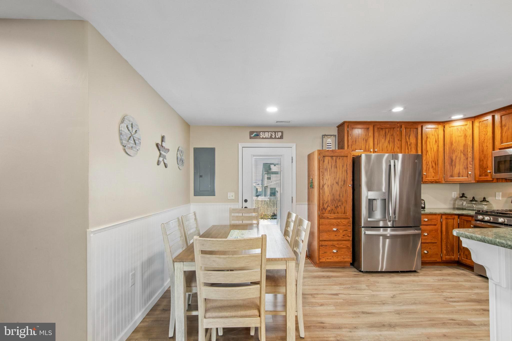 213 West 13th Street Ship Bottom, NJ 08008 - Photo 24 of 70 a kitchen with stainless steel appliances a refrigerator and wooden floor