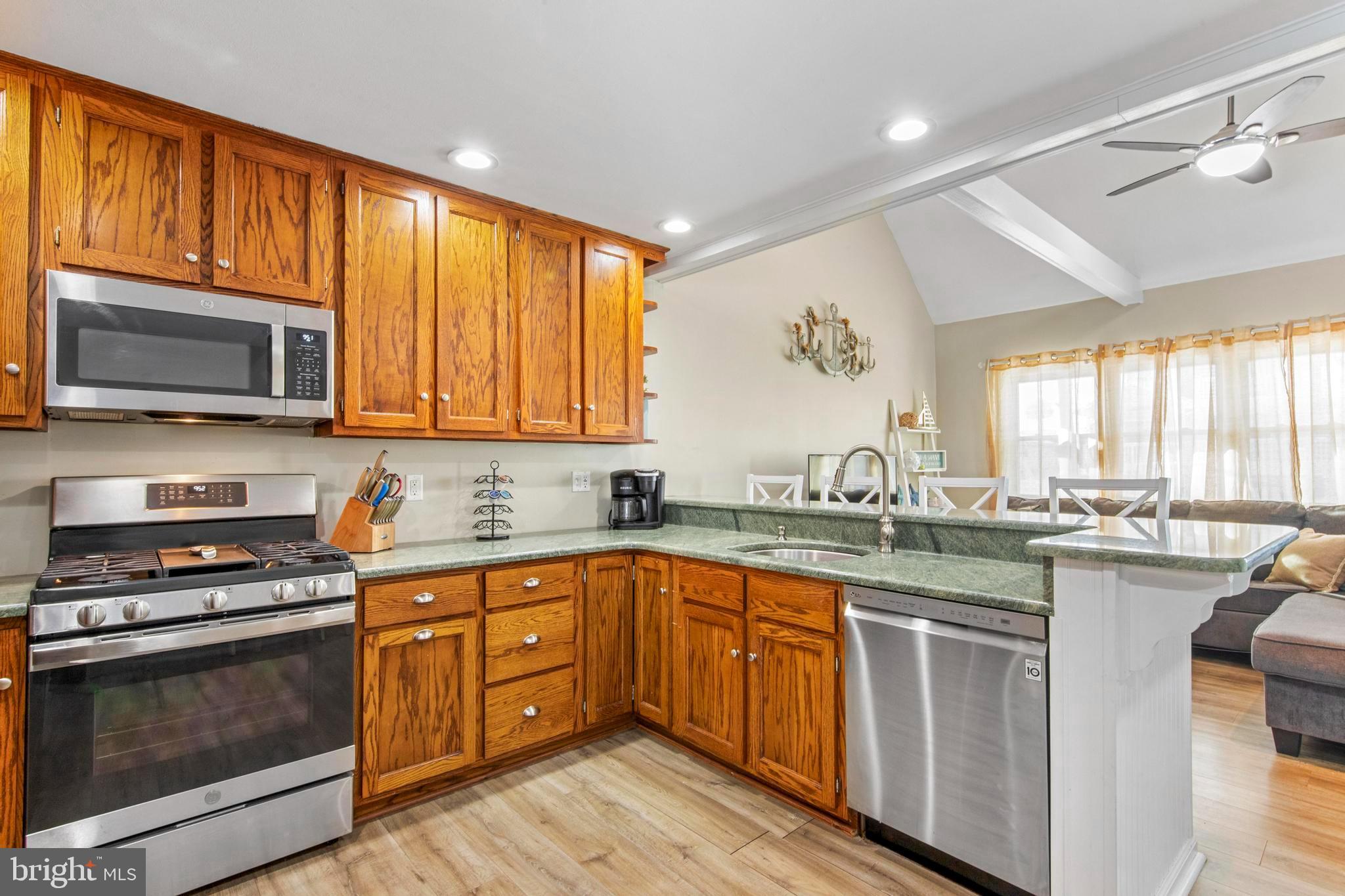 213 West 13th Street Ship Bottom, NJ 08008 - Photo 26 of 70 a kitchen with lots of counter top space a sink and appliances