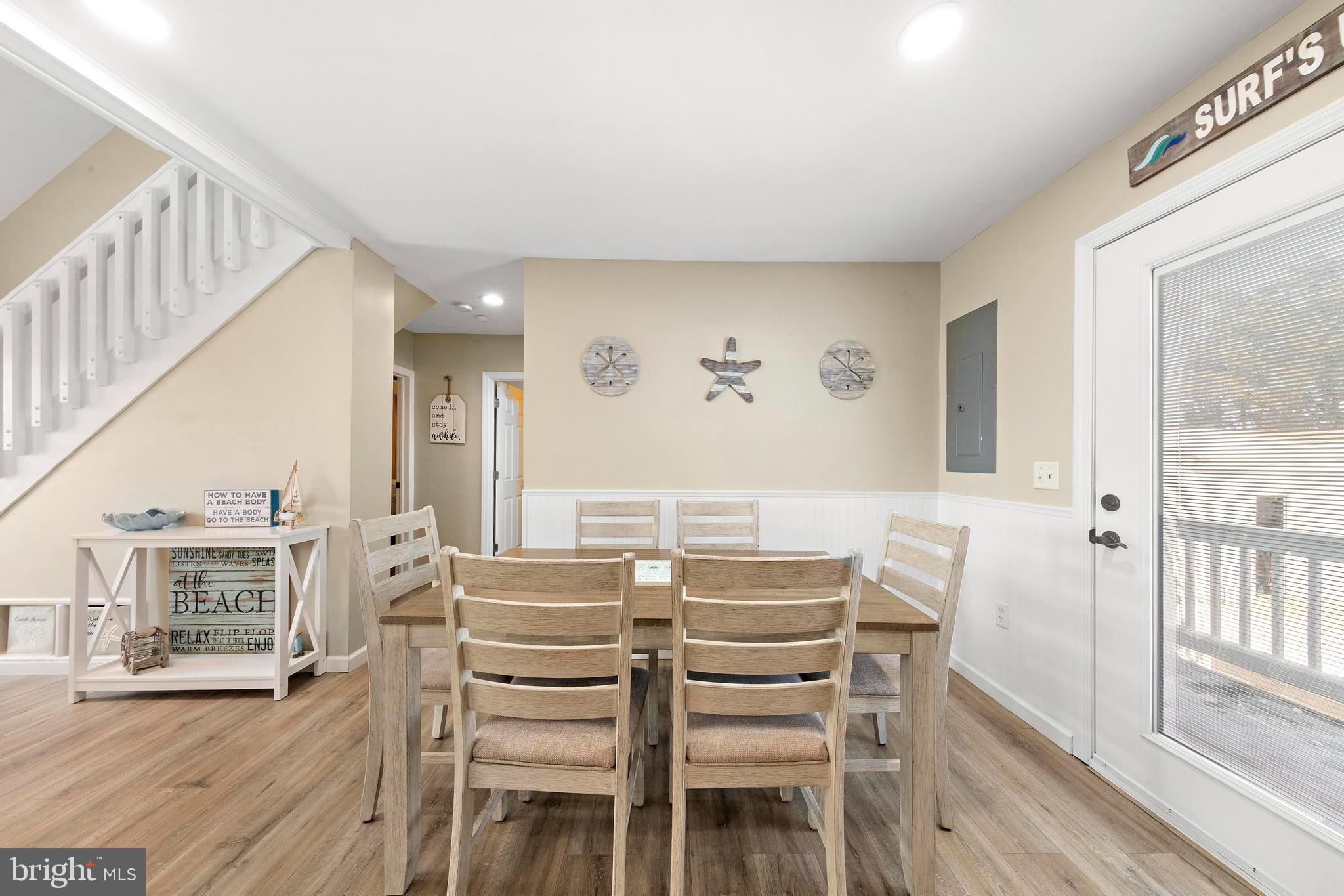 213 West 13th Street Ship Bottom, NJ 08008 - Photo 32 of 70 a dining room with furniture and wooden floor