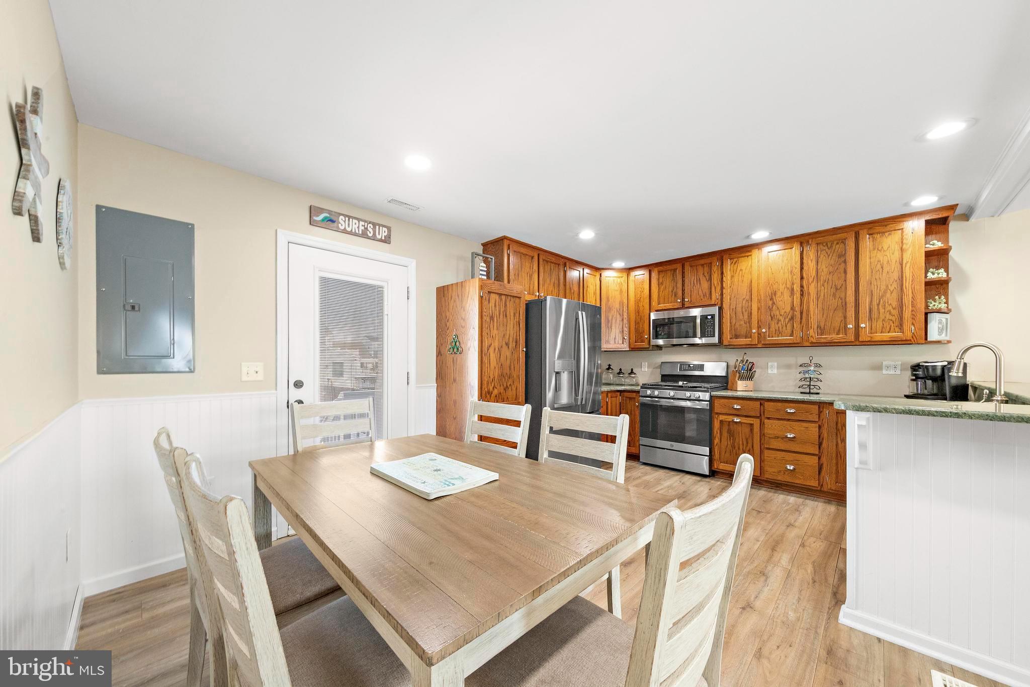 213 West 13th Street Ship Bottom, NJ 08008 - Photo 33 of 70 a large kitchen with a table and chairs
