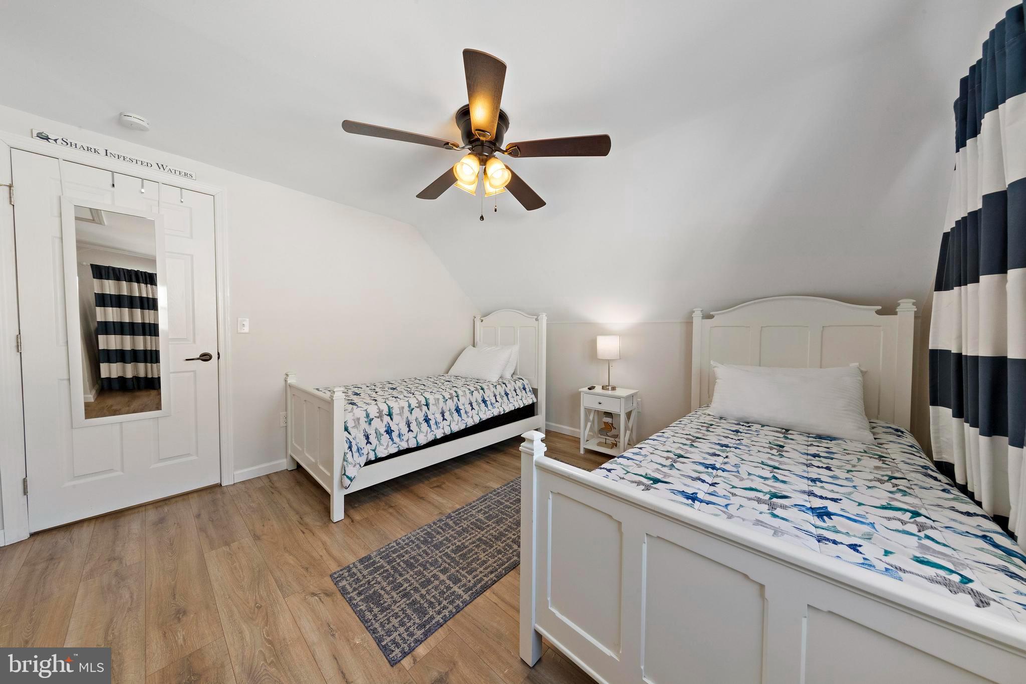 213 West 13th Street Ship Bottom, NJ 08008 - Photo 50 of 70 a bedroom with a bed and a view of kitchen