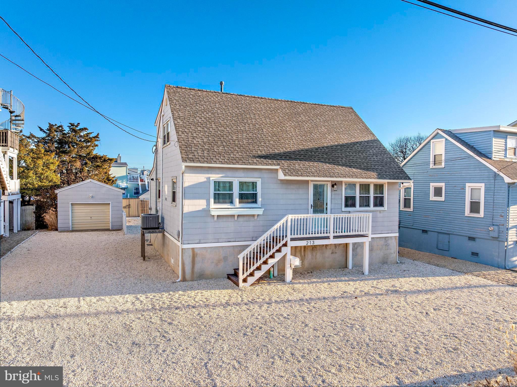 213 West 13th Street Ship Bottom, NJ 08008 - Photo 63 of 70 a front view of a house with a yard