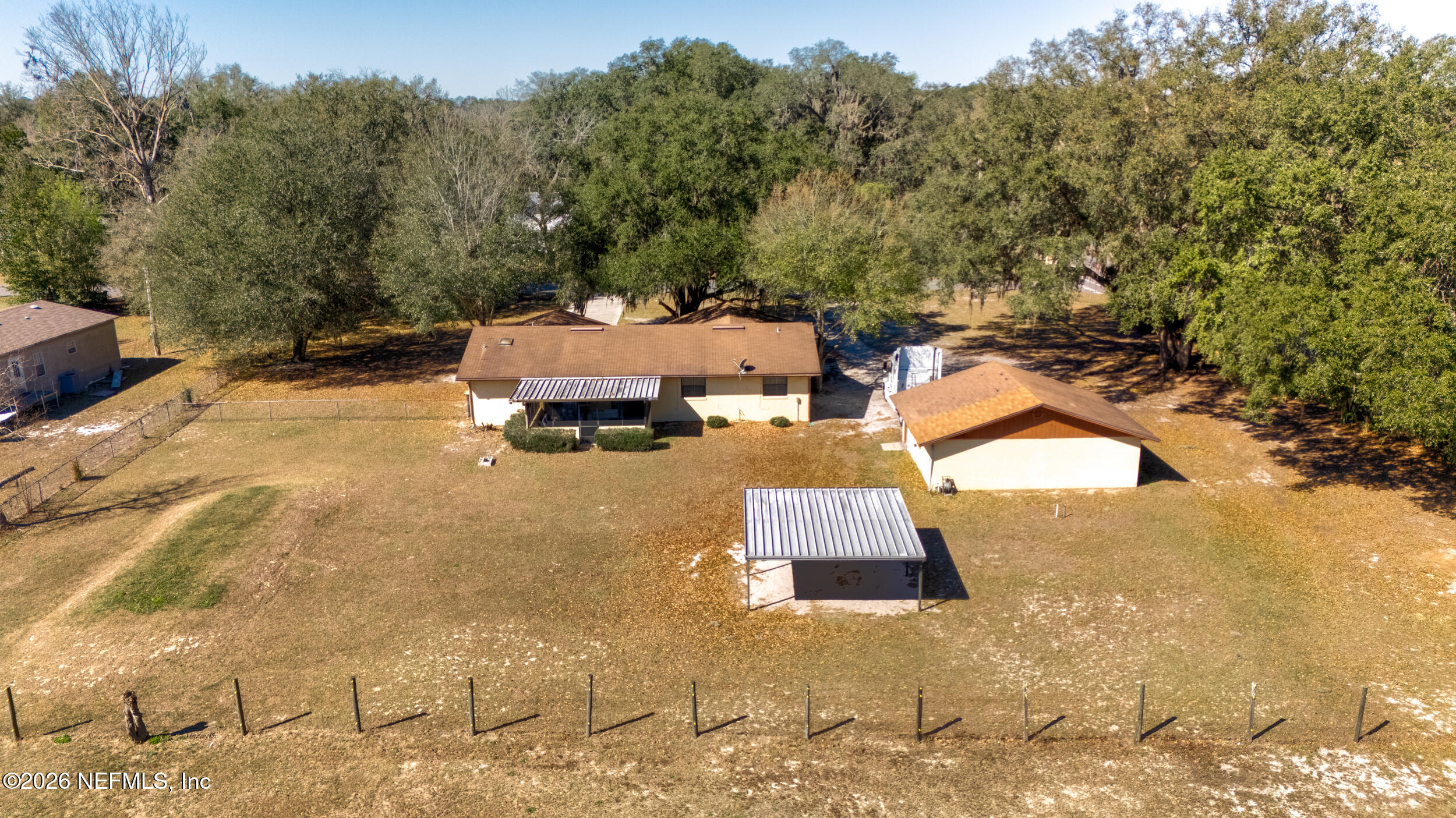 4065 Magill Road Jacksonville, FL 32220 - Photo 17 of 42 an aerial view of a house with swimming pool and trees