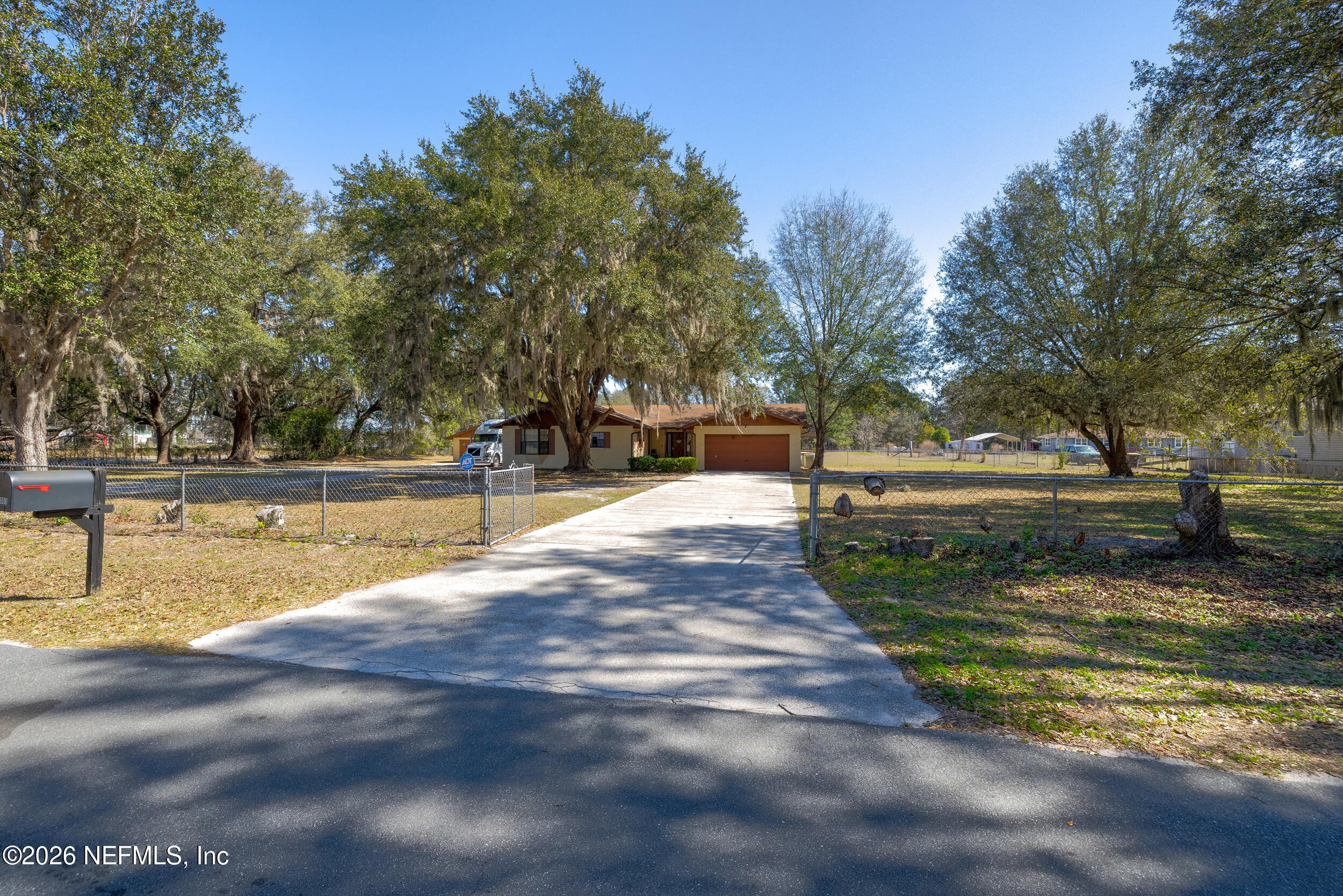 4065 Magill Road Jacksonville, FL 32220 - Photo 21 of 42 a view of yard with swimming pool and trees
