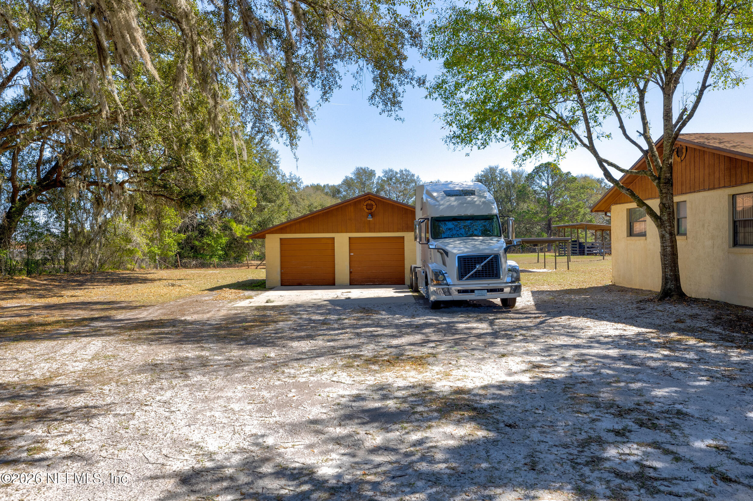 4065 Magill Road Jacksonville, FL 32220 - Photo 26 of 42 a view of a house with a yard