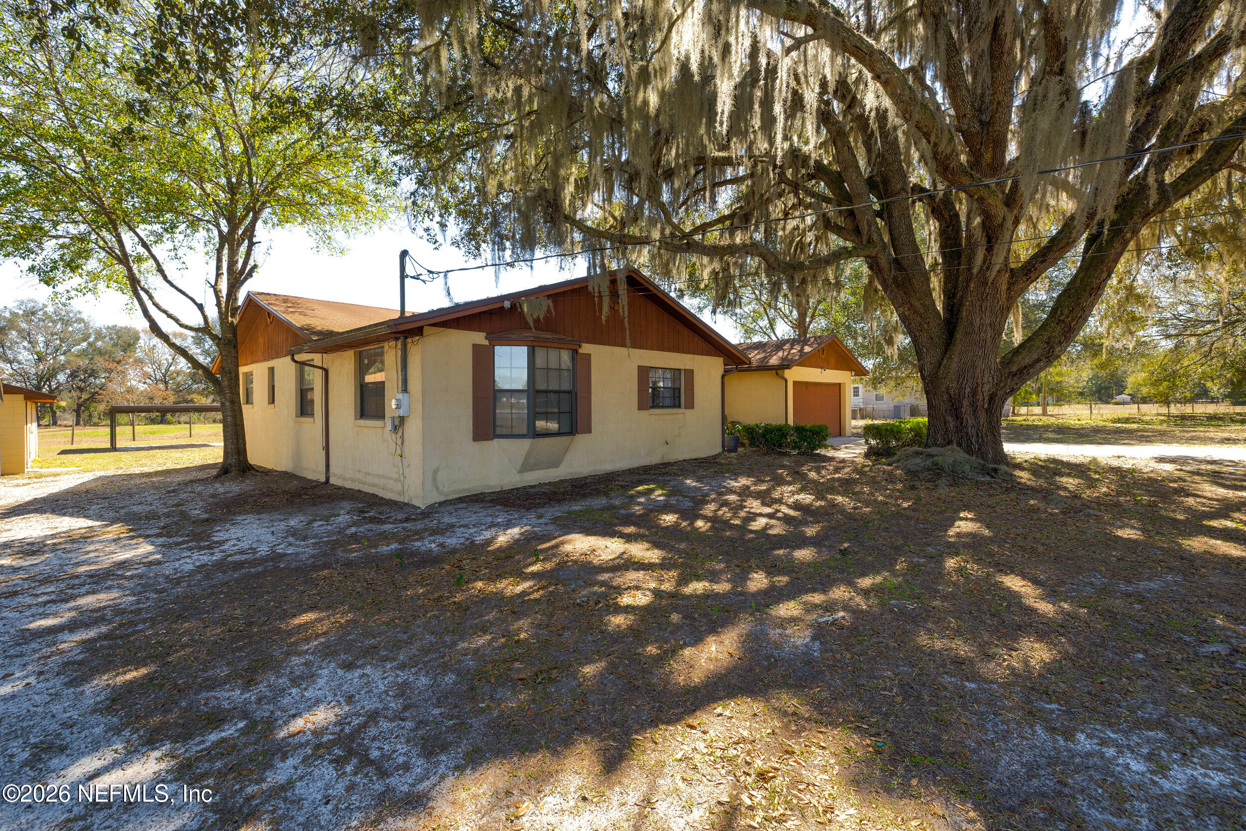 4065 Magill Road Jacksonville, FL 32220 - Photo 27 of 42 a front view of a house with a tree