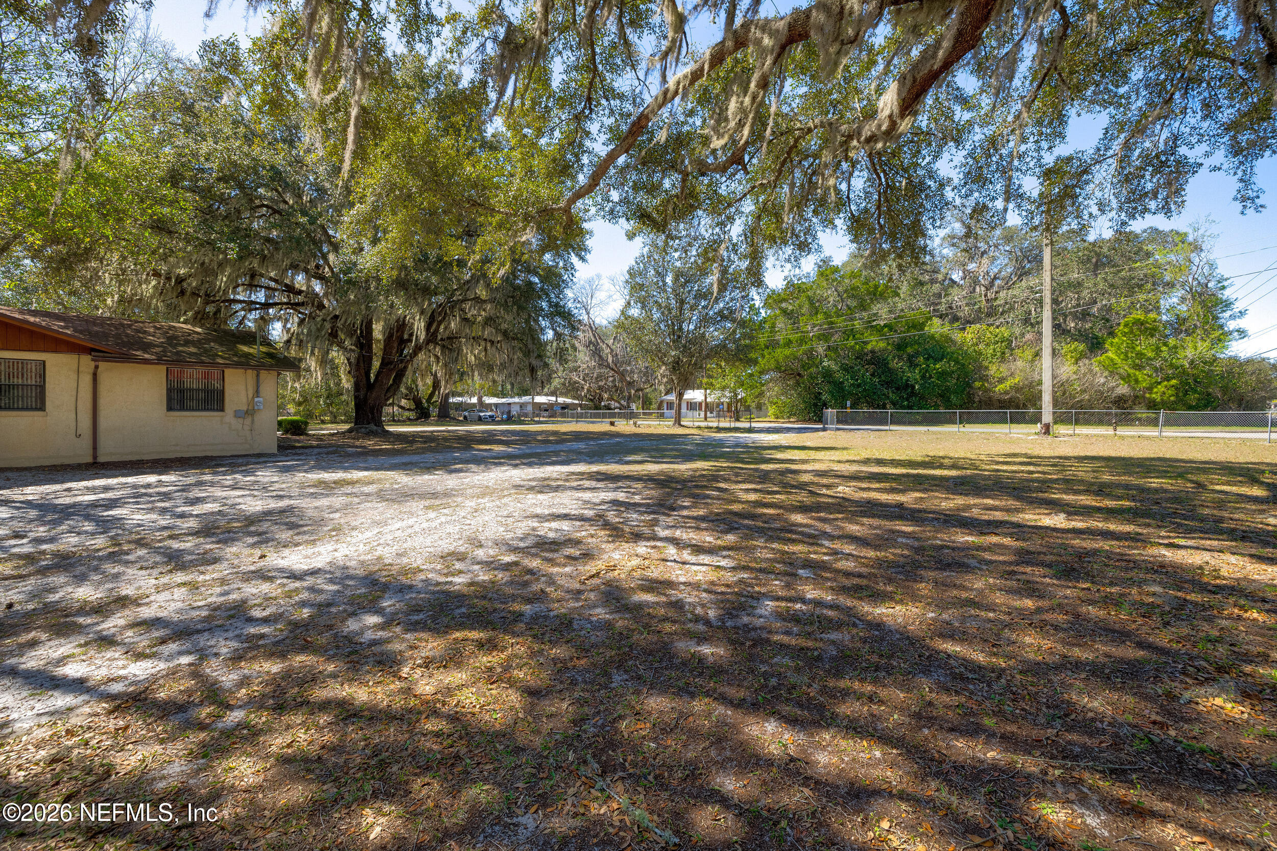 4065 Magill Road Jacksonville, FL 32220 - Photo 28 of 42 a view of a house with a yard and tree s