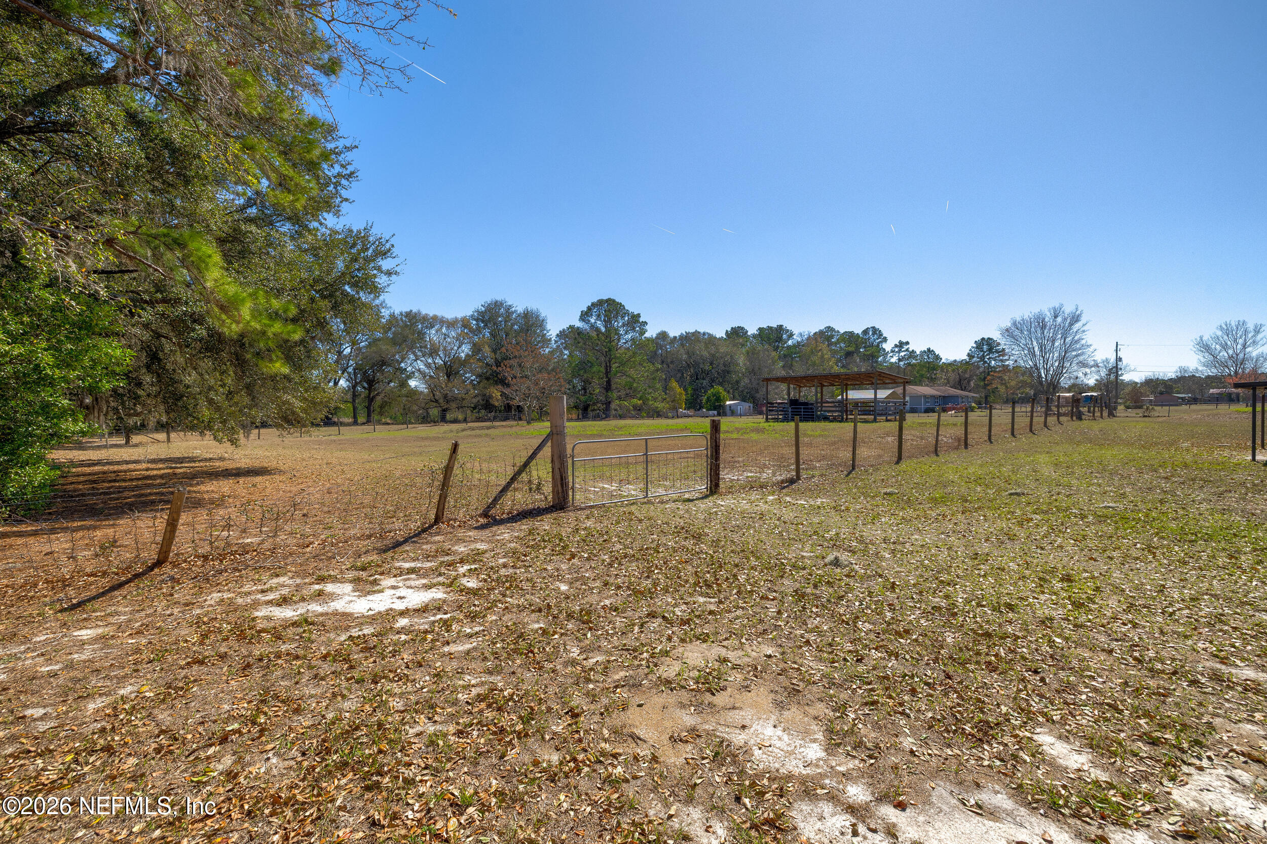 4065 Magill Road Jacksonville, FL 32220 - Photo 30 of 42 a view of a lake with a yard