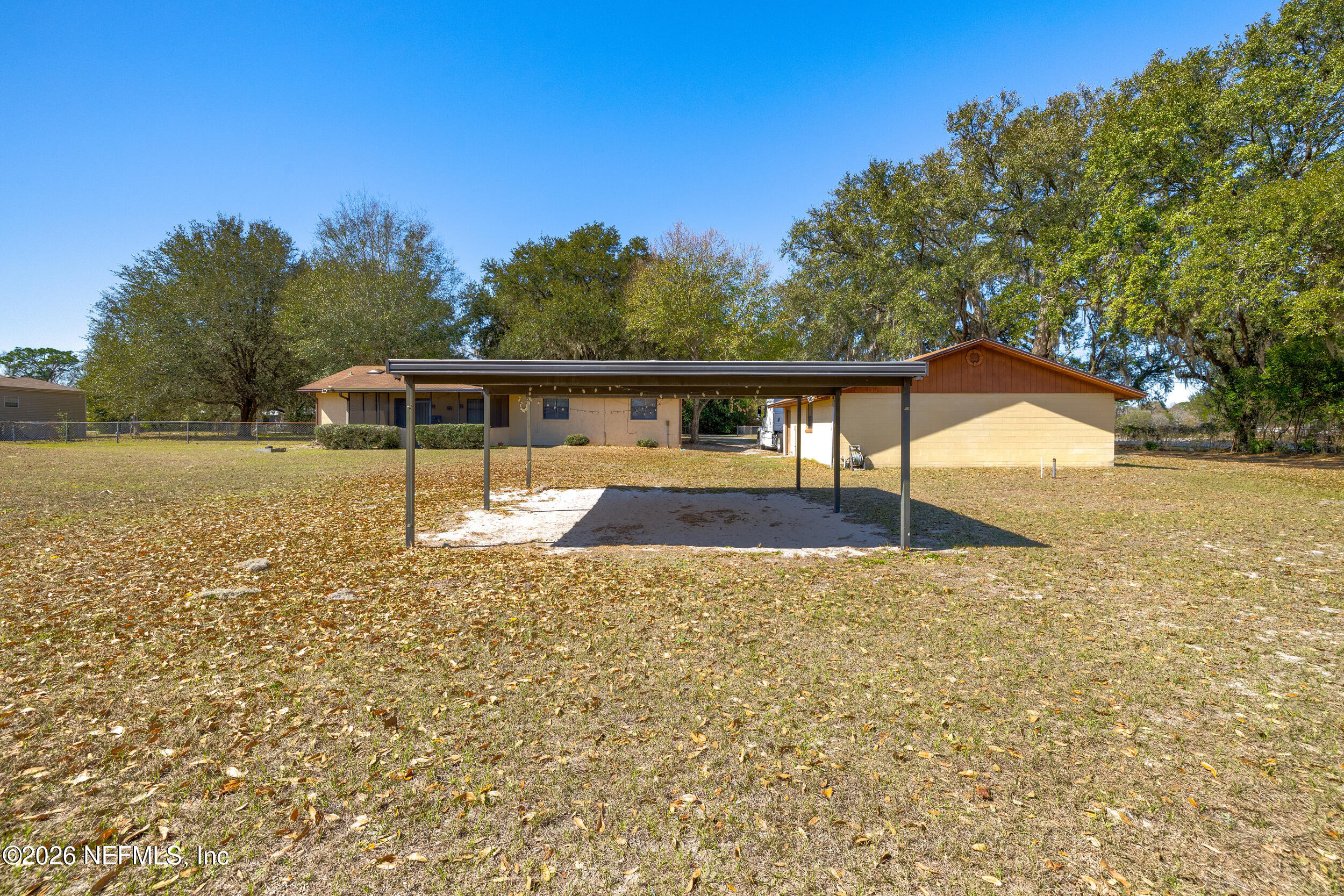 4065 Magill Road Jacksonville, FL 32220 - Photo 35 of 42 a view of a house with backyard and trees