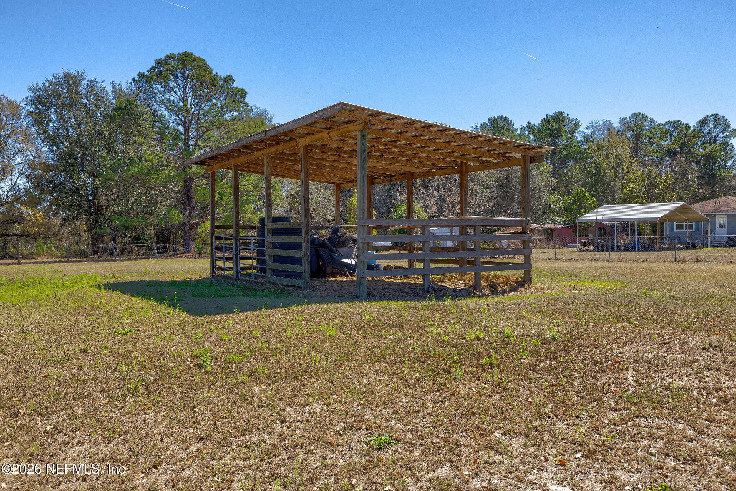 4065 Magill Road Jacksonville, FL 32220 - Photo 36 of 42 a view of a house with backyard porch and sitting area