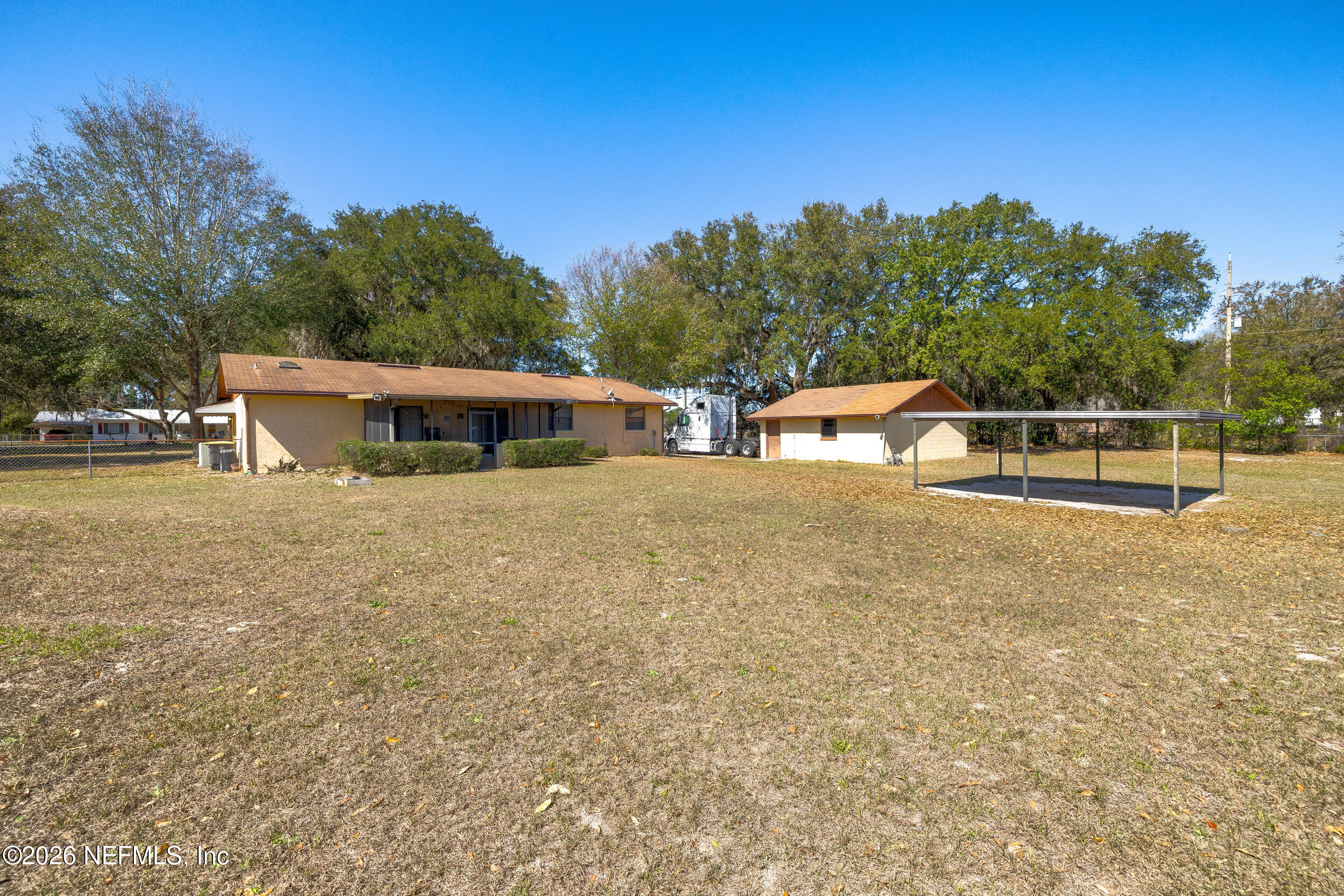 4065 Magill Road Jacksonville, FL 32220 - Photo 39 of 42 a view of house with outdoor space and sitting area