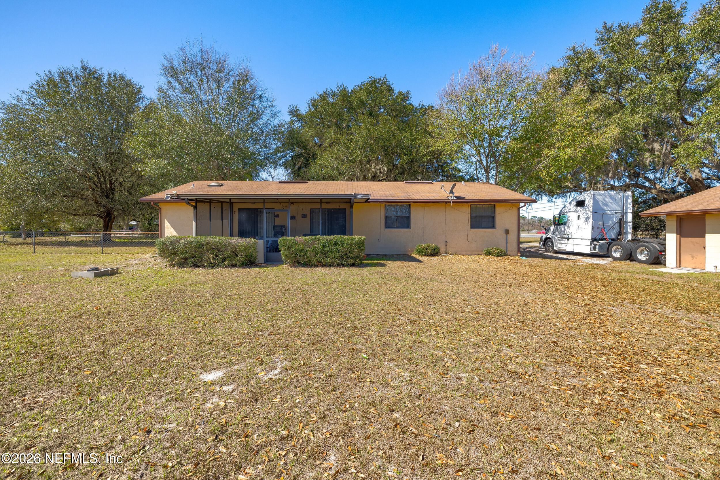 4065 Magill Road Jacksonville, FL 32220 - Photo 40 of 42 a view of house with outdoor space and garden