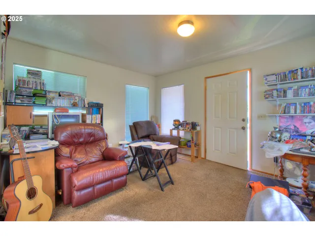 a kitchen with a refrigerator a sink and cabinets