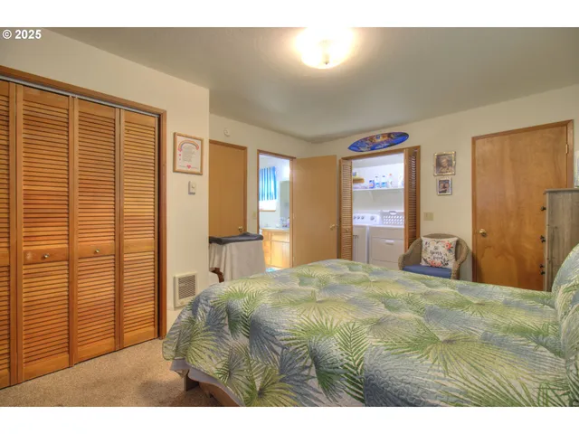 a view of an house with backyard space and balcony