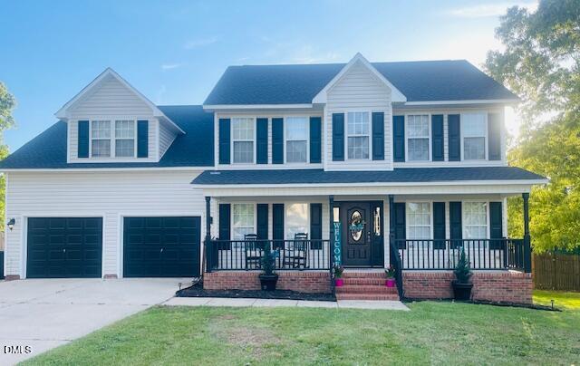 a front view of a house with a yard and porch
