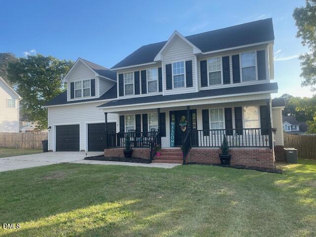 705 Crystal Spring Drive Sanford, NC 27332 - Photo 20 of 21 a front view of a house with a yard and outdoor seating