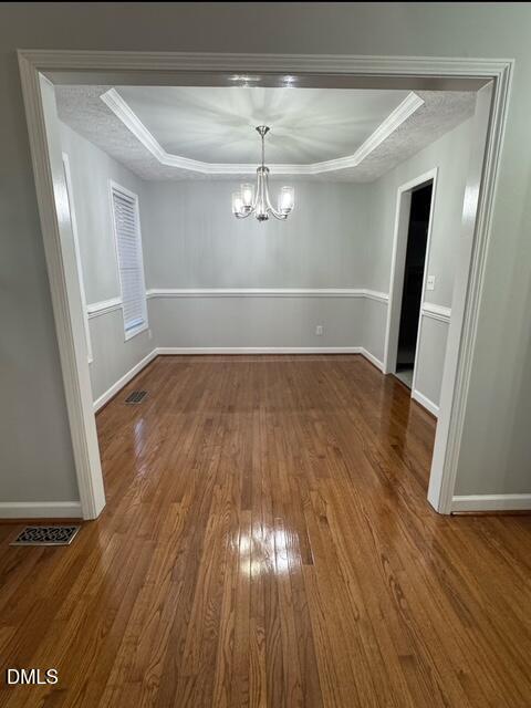 705 Crystal Spring Drive Sanford, NC 27332 - Photo 4 of 21 wooden floor in an empty room with a window