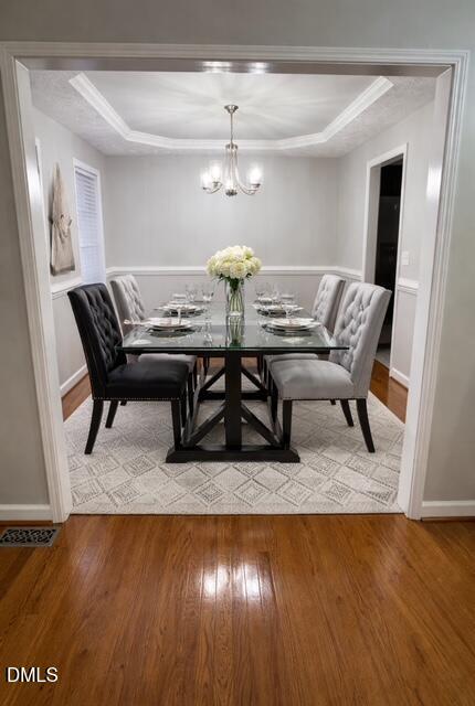 705 Crystal Spring Drive Sanford, NC 27332 - Photo 5 of 21 a view of a dining room with furniture and wooden floor