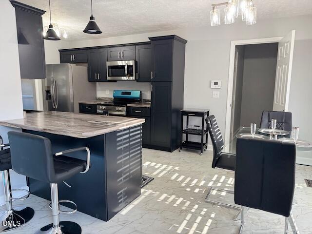 705 Crystal Spring Drive Sanford, NC 27332 - Photo 6 of 21 a kitchen with stainless steel appliances granite countertop a sink stove and refrigerator