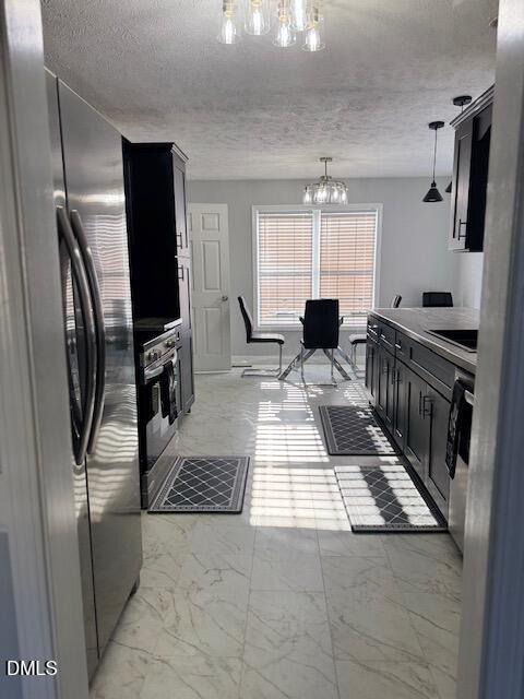 705 Crystal Spring Drive Sanford, NC 27332 - Photo 8 of 21 a kitchen with stainless steel appliances kitchen island granite countertop a refrigerator and a stove top oven