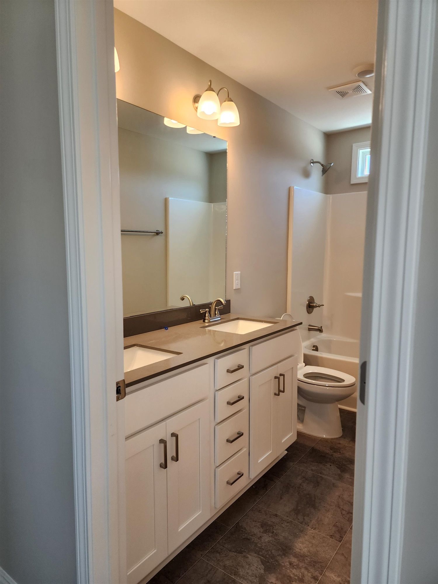 350 Josey Williams Road Erwin, NC 28339 - Photo 20 of 27 double vanity in hall bath and window for natural light