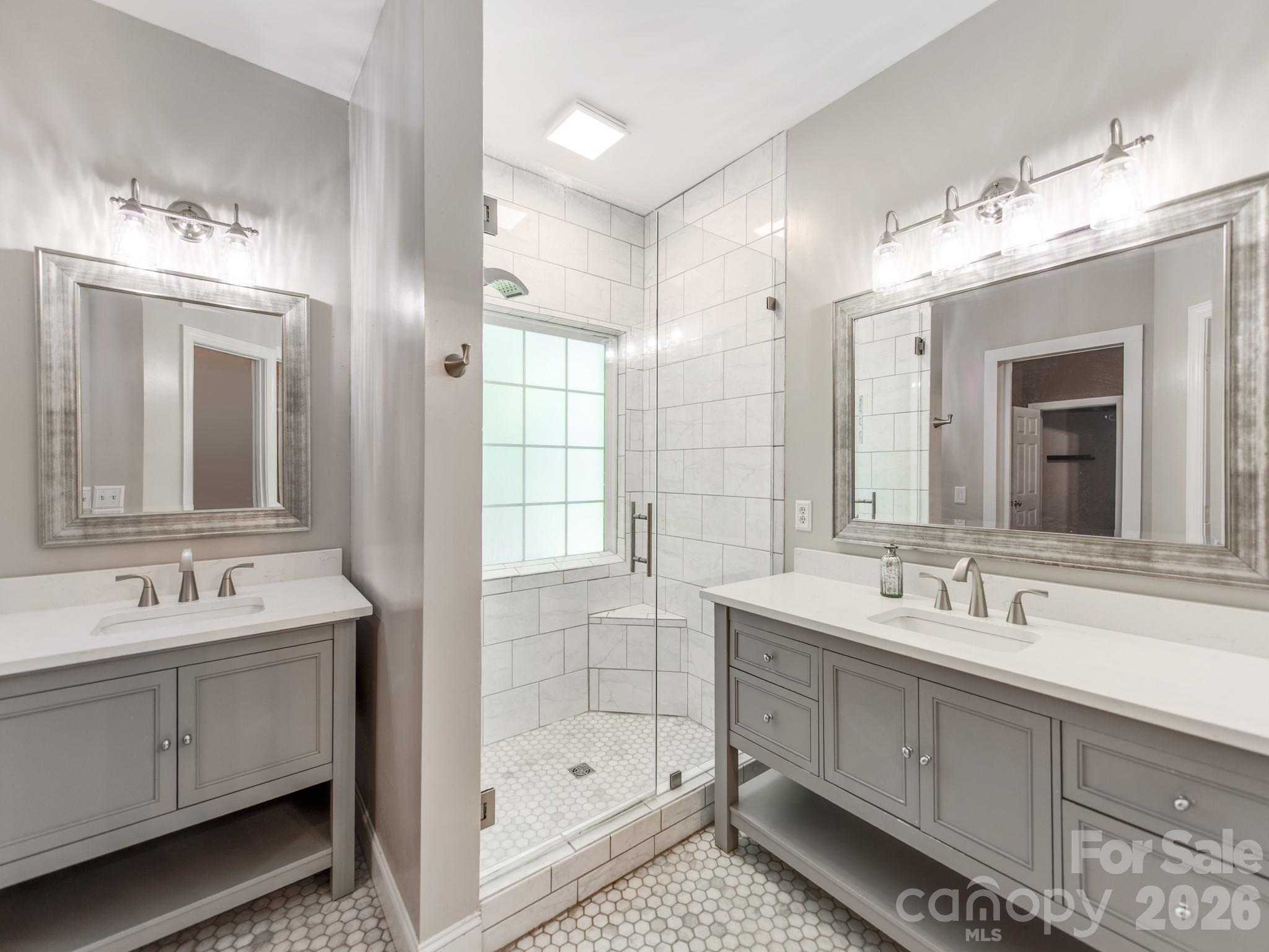 783 Sloan Street Denver, NC 28037 - Photo 23 of 44 a bathroom with a double vanity sink mirror and double