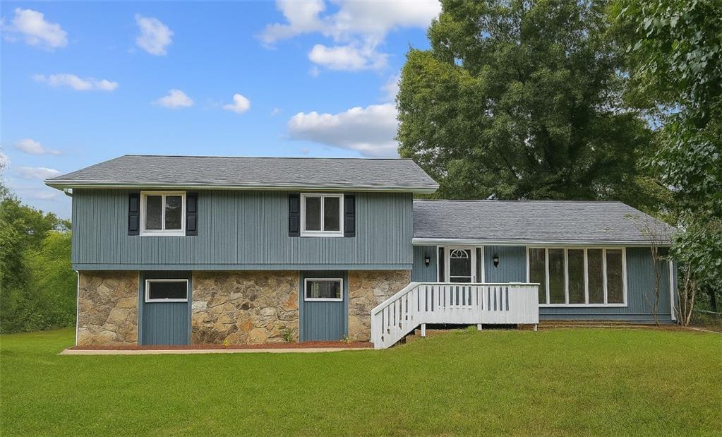 a front view of a house with a garden