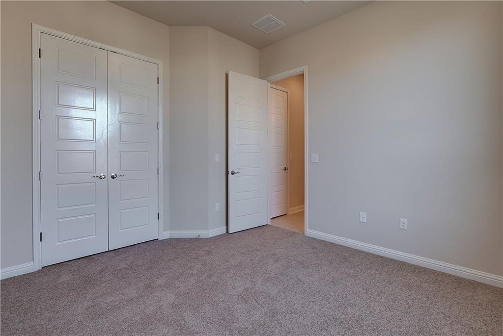 6907 Idea Road Austin, TX 78741 - Photo 13 of 29 Main level bedroom or office with a full bath off the hallway