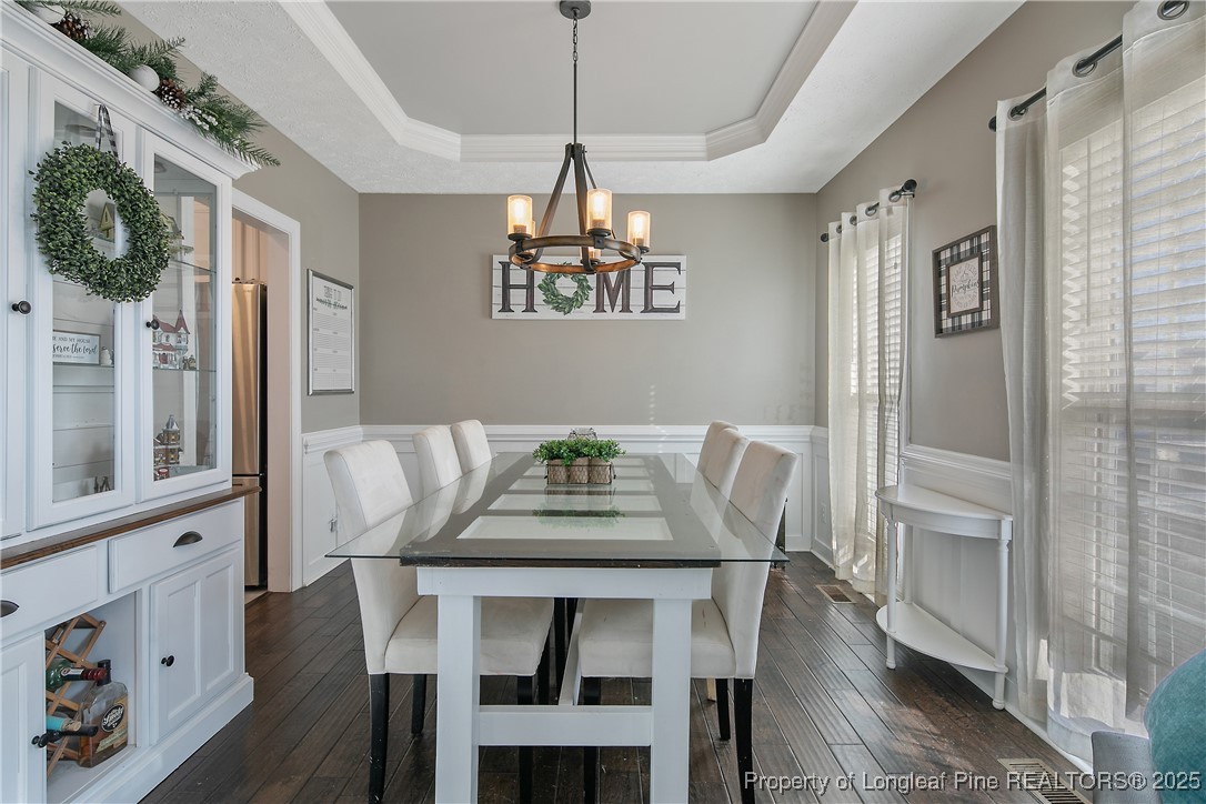 3524 Talus Road Fayetteville, NC 28306 - Photo 12 of 47 a view of a dining room with furniture window and wooden floor