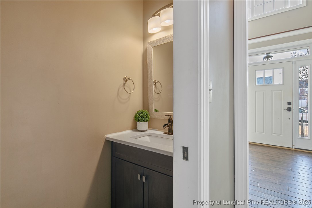 3524 Talus Road Fayetteville, NC 28306 - Photo 13 of 47 a bathroom with a sink and a mirror