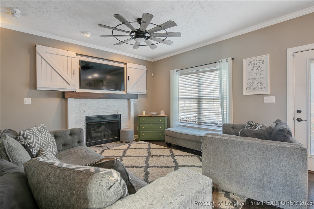 3524 Talus Road Fayetteville, NC 28306 - Photo 14 of 47 a living room with furniture and a fireplace