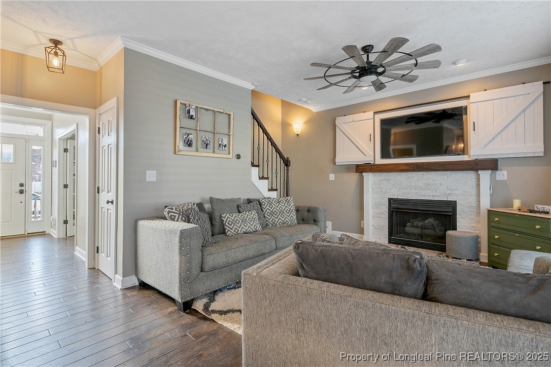 3524 Talus Road Fayetteville, NC 28306 - Photo 16 of 47 a living room with furniture and a fireplace